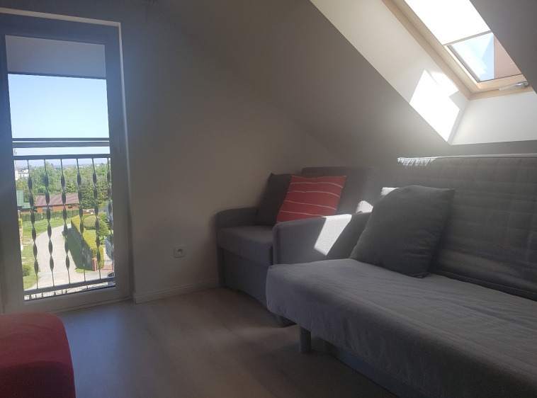 Apartament Przy Plaży 3 rozkładany fotel z funkcją spania  oraz kanapa rozkładana w pokoju dziennym?v=1.0